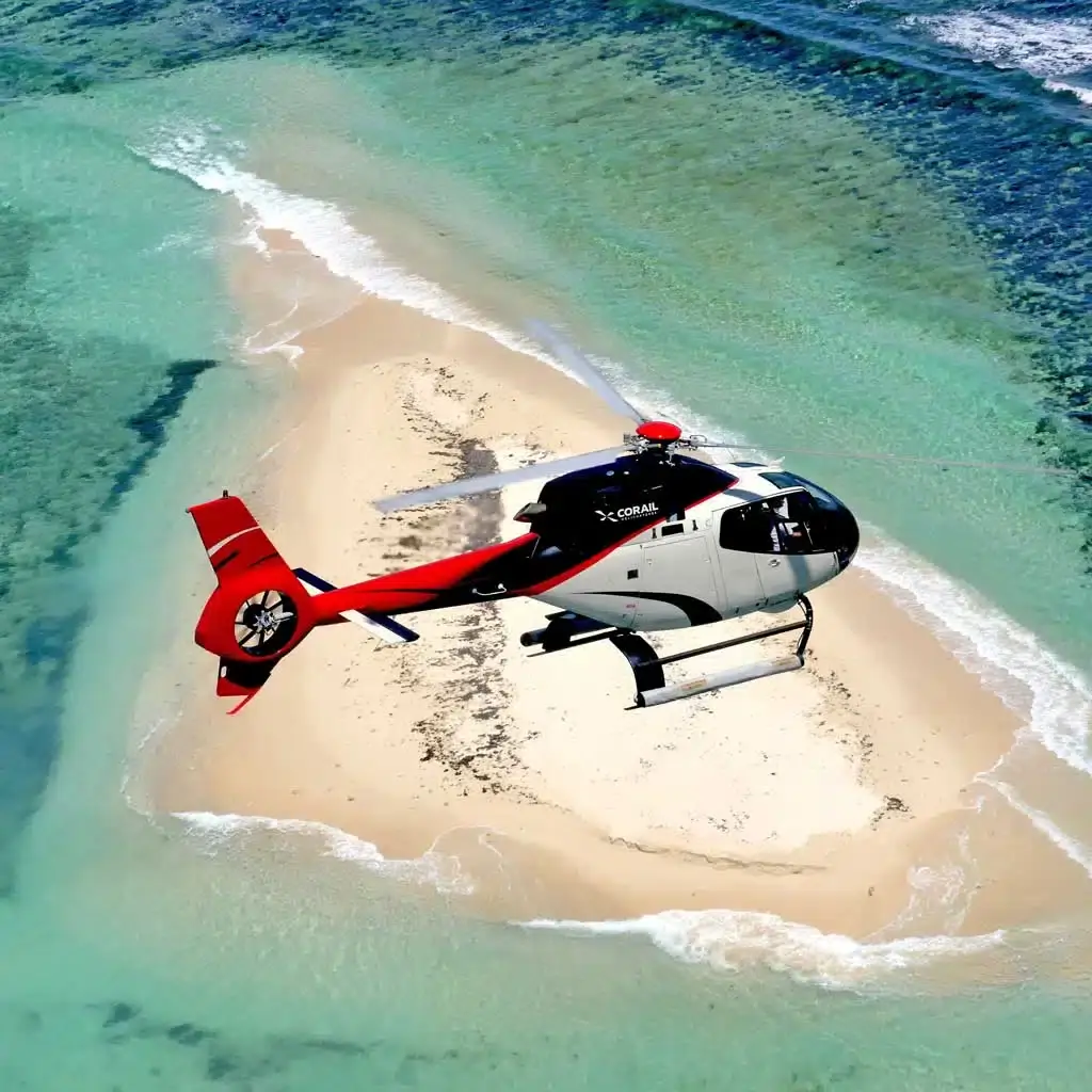 Helicopter above Île aux Flamants and the turquoise lagoon on Mauritius’s East Coast.